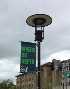 Missouri S&T's "Miners Dig Deeper" tagline graces university banners across campus.